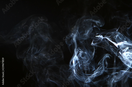 marvellous flowing contrast bright smoke against black background.