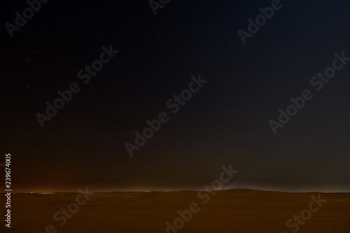 Night sky with stars above arabian desert
