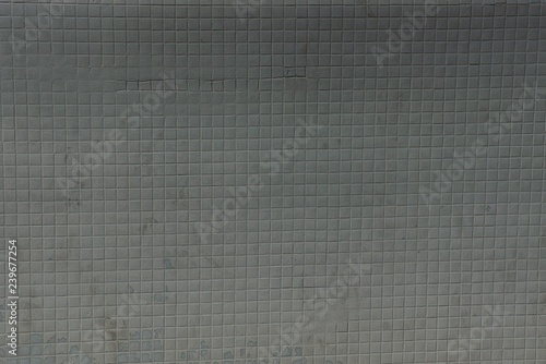 dark gray texture of small square ceramic tiles