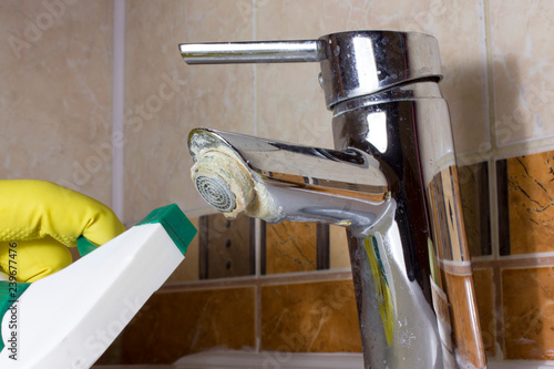 Cleaning of faucet from  scum, limy raid.