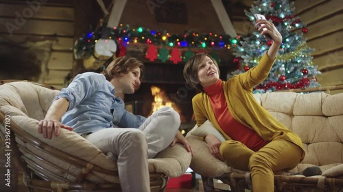 Woman takes phot of herself with young man on Christmas night