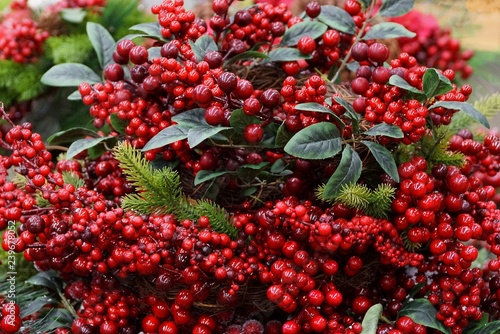 new year decor from artificial red berries and green leaves