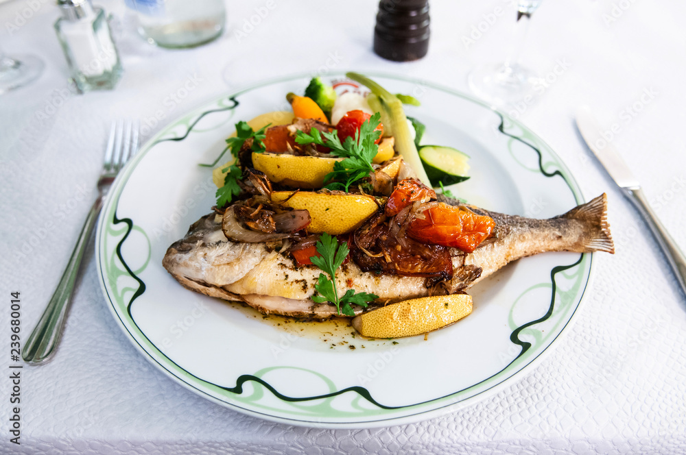 Fish dish - roasted fish, vegetables and lemon