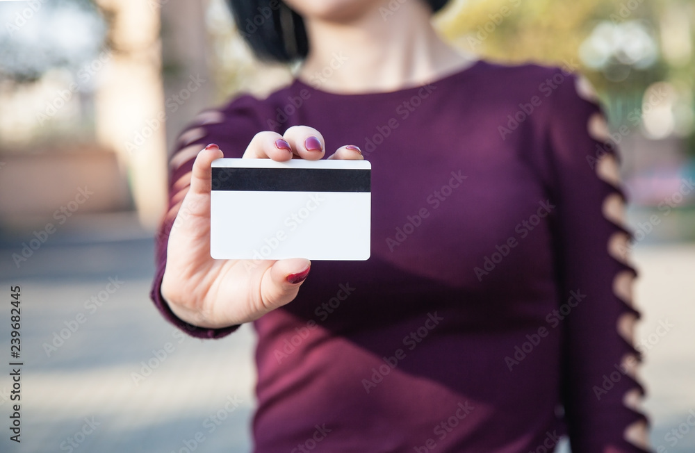 Caucasian woman showing credit card. Caucasian woman showing credit card.