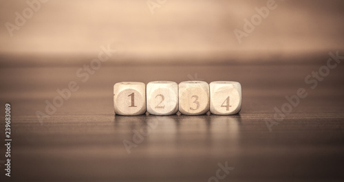 Wooden cubes on wood table.