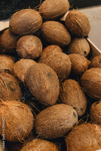 Pile of coconuts, tropical fruits background