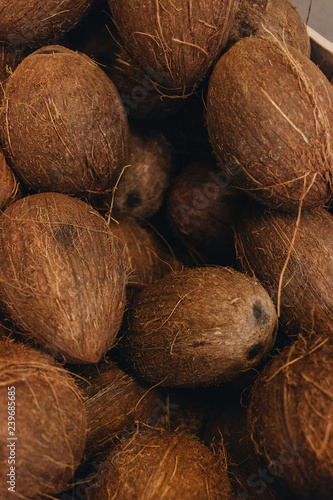 Pile of coconuts, tropical fruits background