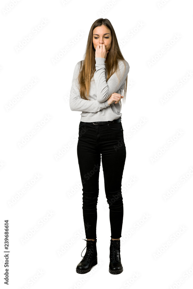 Full-length shot of young girl having doubts on isolated white background Full-length shot of young girl having doubts on isolated white background