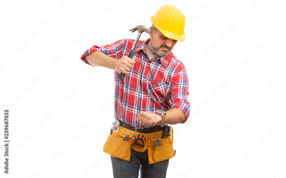Builder preparing to destroy wristwatch with hammer. Builder preparing to destroy wristwatch with hammer.