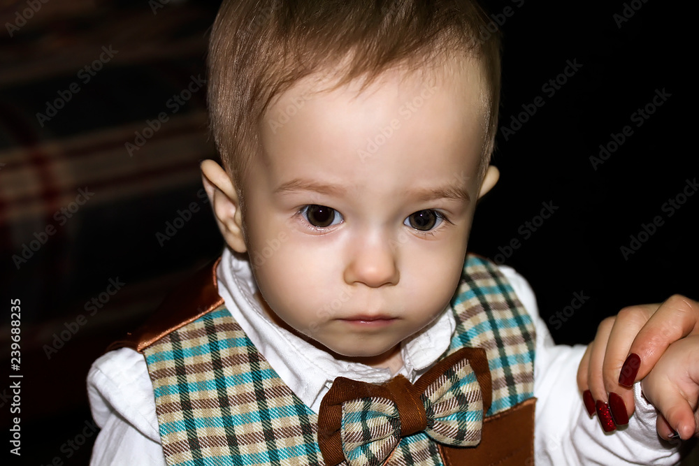 Serious cute baby is looking away. Portrait Serious cute baby is looking away. Portrait