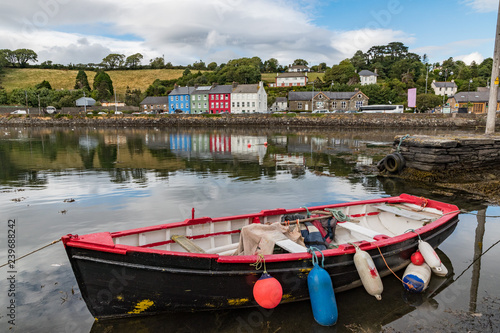 Old fishing boat docked in the small coastal  town of Bantry, Ireland photo