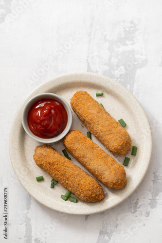 meat croquets with sauce on dish