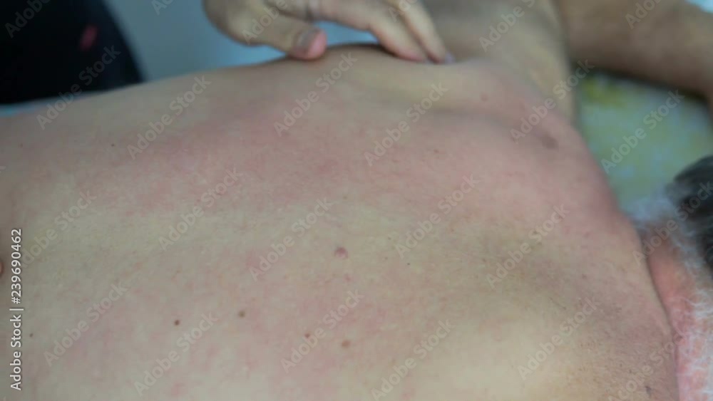 Professional masseur makes massage for old man Professional masseur makes massage for old man