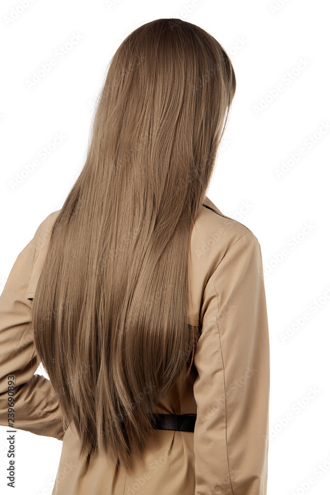 A back view side portrait of a lady with long straight light brown hair,  wearing a