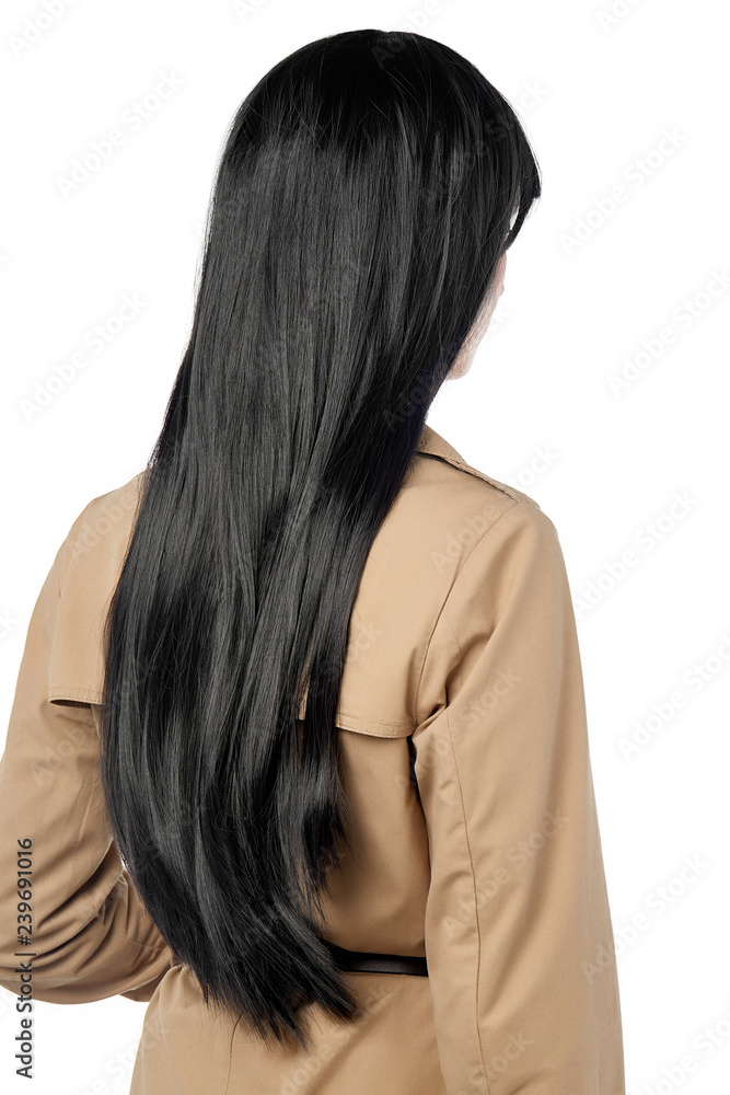 A back view side portrait of a lady with long straight black hairstyle,  wearing a beige