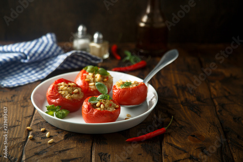 Quinoa stuffed tomatoes with pine nuts and basil