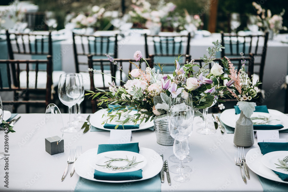 Wedding table setting and decoration. Flowers.
