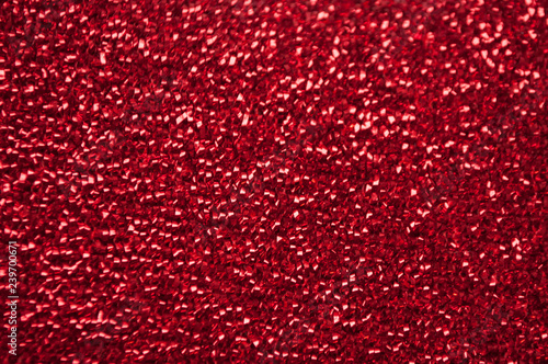 Red glittery shimmering background with blinking details.