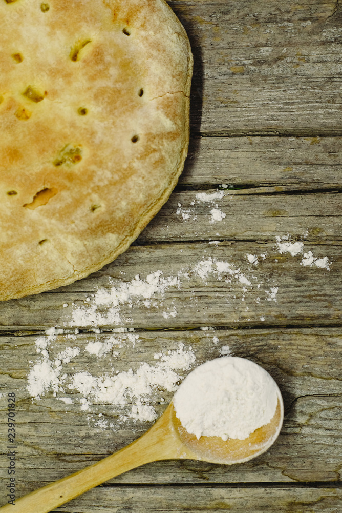 Pizza Calzone on old wooden table Pizza Calzone on old wooden table