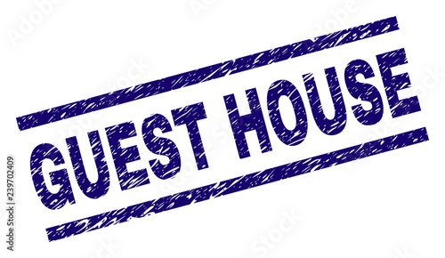 GUEST HOUSE seal print with grunge style. Blue vector rubber print of GUEST HOUSE text with scratched texture. Text tag is placed between parallel lines.
