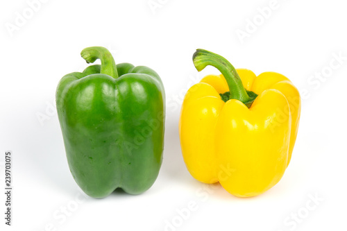 Two bell peppers on white background