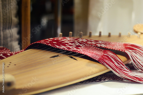 Canvastavla psaltery, Latvian kokles, zither, ancient traditional folk instrument with decor