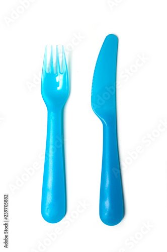 set of blue baby plastic fork and knife on white background