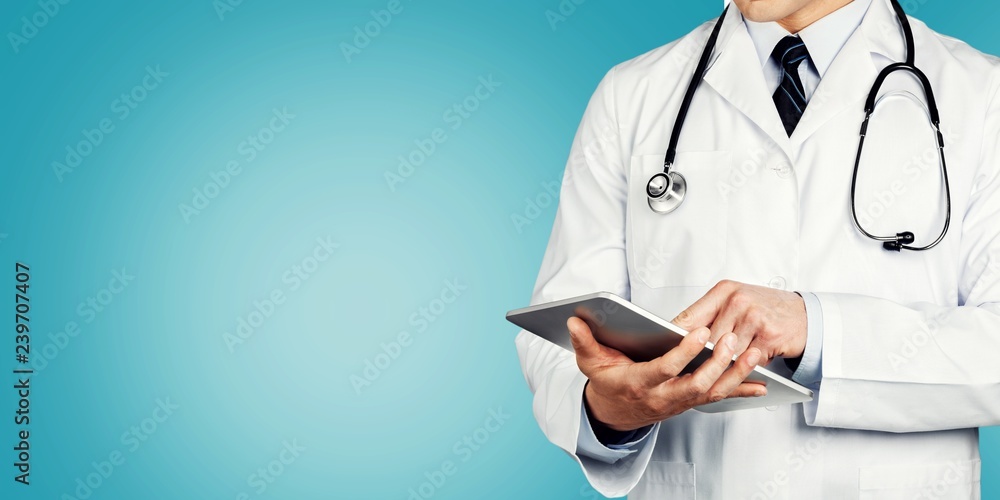 Close-up Doctor at hospital working with tablet Close-up Doctor at hospital working with tablet