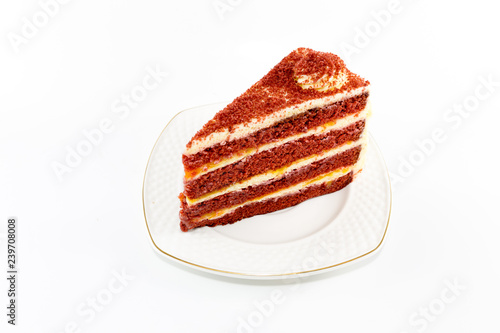 Red valvel cream cheese cake on white isolated background with copy space. photo