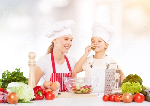 Beautiful girl with colored vegetables showing thumbs up