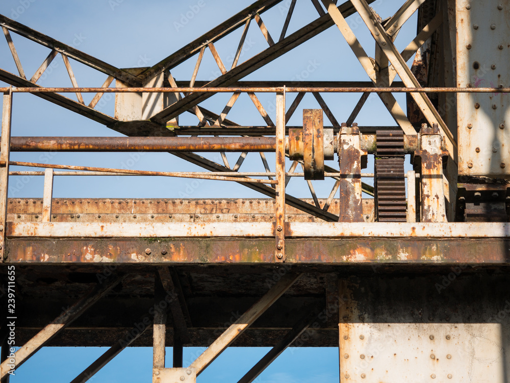 Old, rusty, dilapidated metal loading winch in the abandoned dock