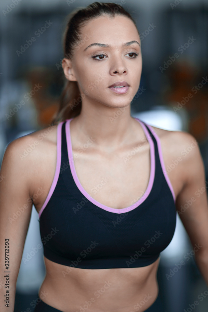 Fototapeta premium close up.portrait of a confident young woman in the gym.