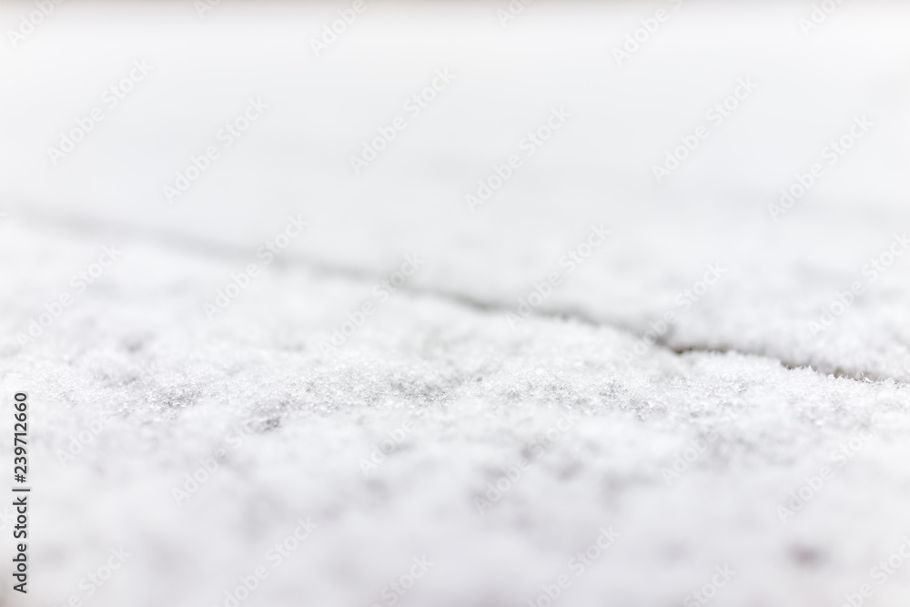 Closeup of wooden deck of house backyard with snow covered wood floor during blizzard white storm, snowflakes falling, abstract isolated Closeup of wooden deck of house backyard with snow covered wood floor during blizzard white storm, snowflakes falling, abstract isolated