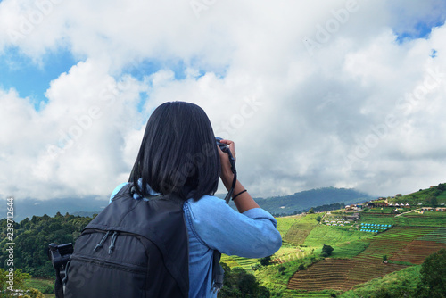 Wallpaper Mural Photographer taking a photo with mountain landscape Torontodigital.ca