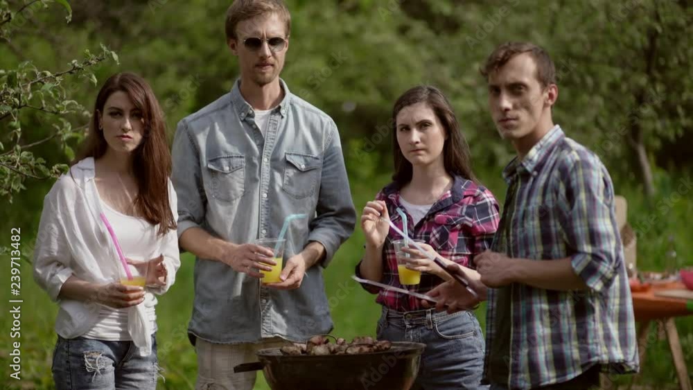 Friends having a barbecue in nature Friends having a barbecue in nature