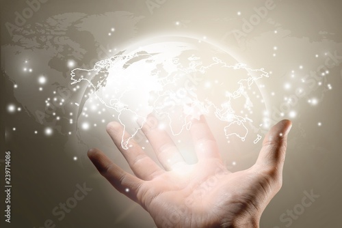 Hand holding glowing digital world map on background