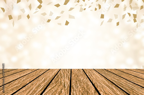 blur elegance gold bokeh  background with confetti spreading and wood tabletop for show promote product on display in happy new year season  and special day concept