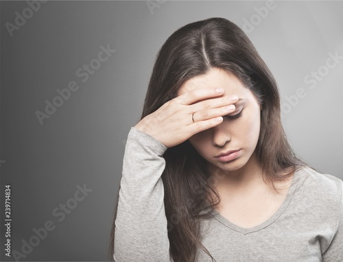 Young woman crying on background