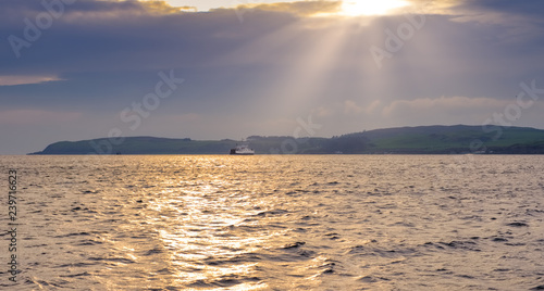 Distant car Ferry Crossing from Millport to largs In Winter Scotland