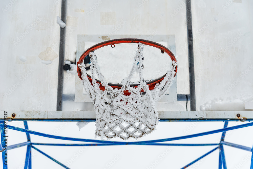 Fototapeta premium Basketball court covered with snow