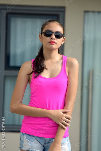 Teenage Female With Long Hair Wearing Sunglasses