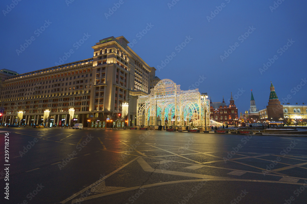 Bright Moscow street at the night time. Manezhnaya square had been illuminated very brightly.