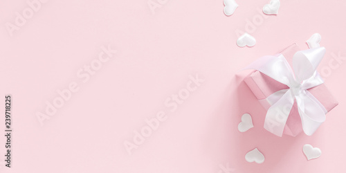 Elegant composition for Valentine's Day. Gift box on pastel pink background. Valentine day concept, design. Flat lay, top view, copy space, banner © prime1001