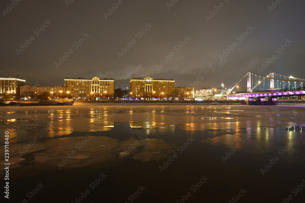 Winter in Moscow. Image of Moskva river and embankment in the cold night.