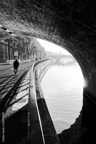 Fototapeta Cyclist and seine river quay in Paris