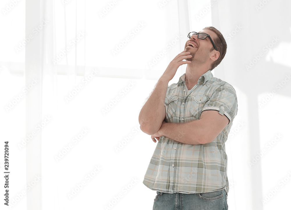 smiling man looks up at a copy of the space smiling man looks up at a copy of the space