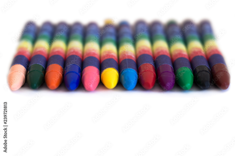Colored wax pencils on a white background close-up Colored wax pencils on a white background close-up