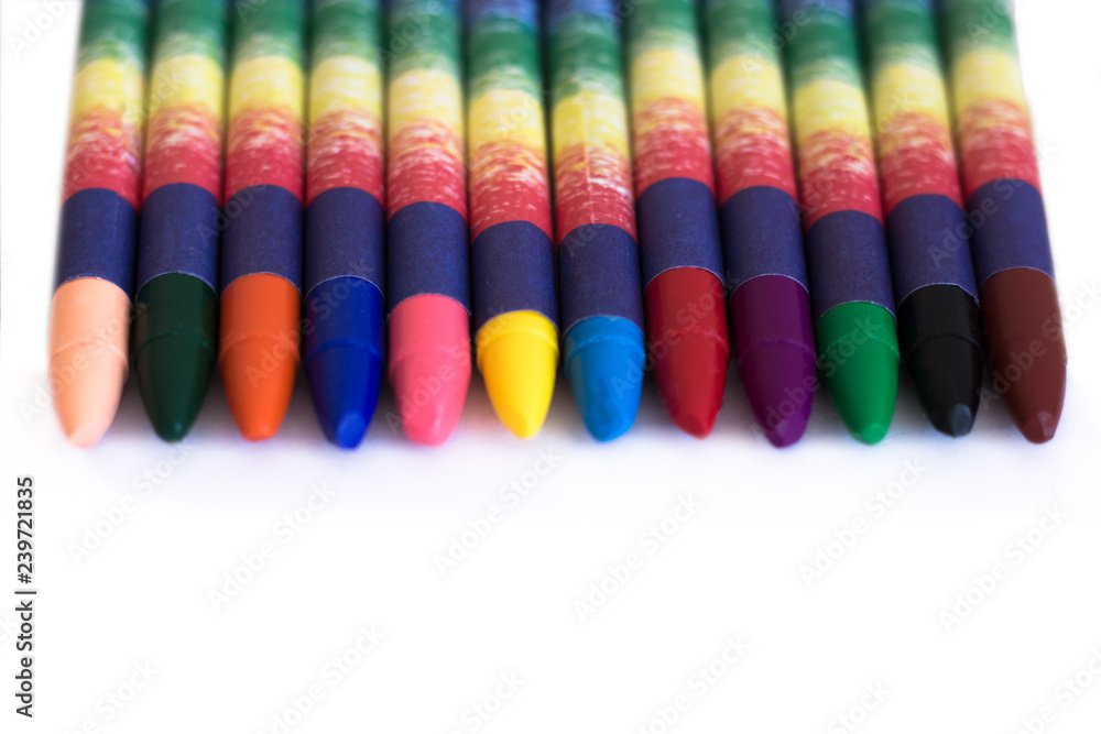 Colored wax pencils on a white background close-up Colored wax pencils on a white background close-up