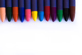 Colored wax pencils on a white background close-up