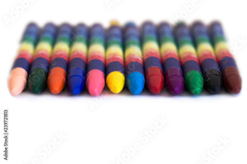 Colored wax pencils on a white background close-up